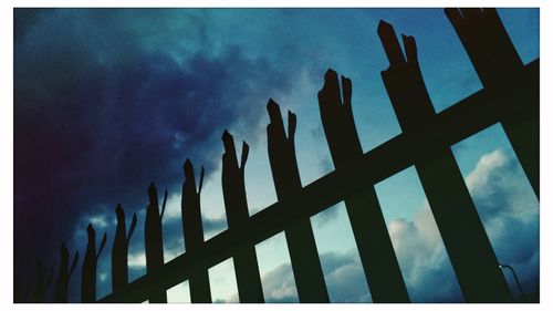 Low angle view of silhouette against sky