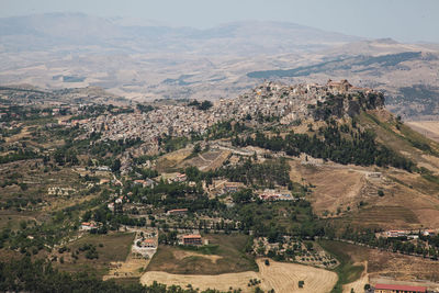 High angle view of trees and buildings in city