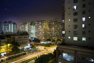 High angle view of illuminated buildings in city at night