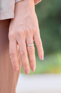 Close-up of couple holding hands
