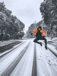 Person walking on snow covered mountain