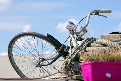 Low angle view of bicycle against sky