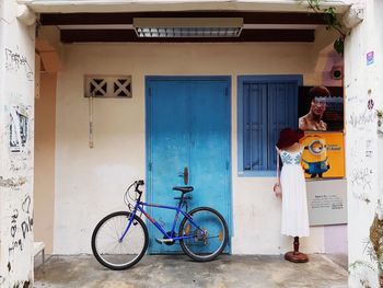 Man standing on bicycle