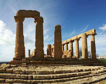 Architectural columns against sky