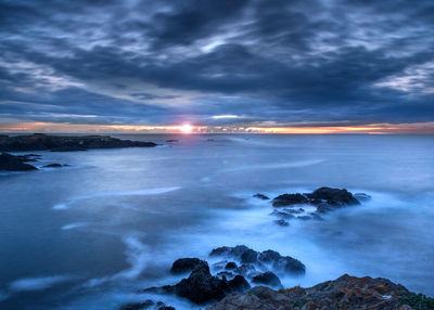 Scenic view of sea against sky during sunset