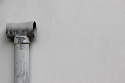 Close-up of white pipes on wall