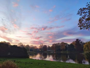 Scenic view of lake against sky during sunset
