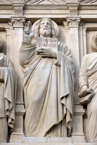 Jesus christ, statue on the facade of saint augustine church in paris, france