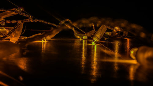 Close-up of illuminated reflection in water