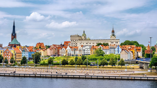 View of buildings against cloudy sky