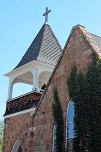 Low angle view of bell tower against clear sky