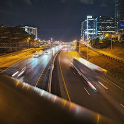 High angle view of light trails on road at night