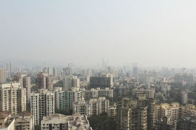 Aerial view of cityscape against clear sky