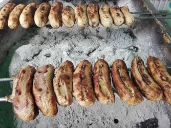 High angle view of meat on barbecue grill