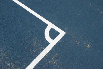 High angle view of arrow sign on road