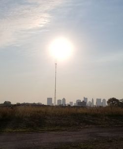 Scenic view of buildings against sky during sunset