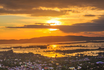 Scenic view of sunset over city