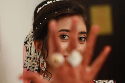 Portrait of bride showing rings during wedding ceremony