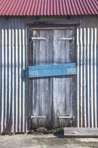 Closed wooden door of building