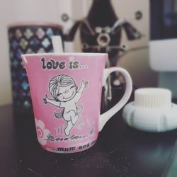 Close-up of coffee cup on table