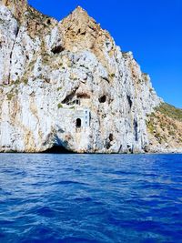 Scenic view of sea against clear blue sky