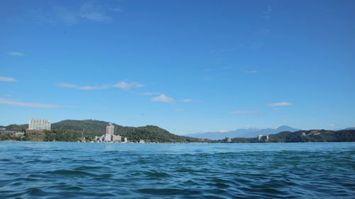 Scenic view of sea against blue sky