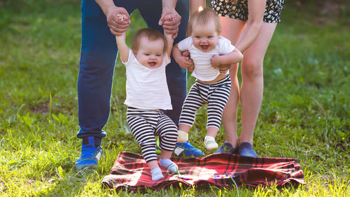 Full length of baby playing on grass