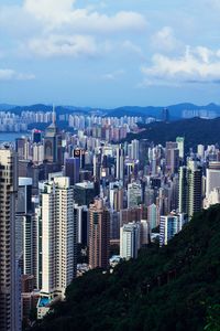 Cityscape against cloudy sky