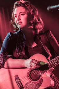 Young woman playing guitar