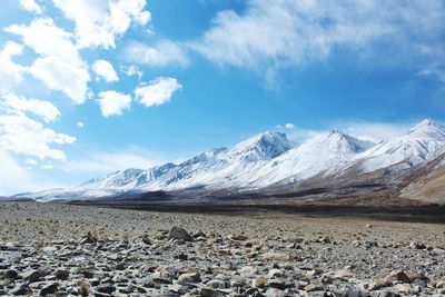 Scenic view of snowcapped mountains against sky