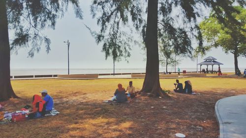 People relaxing on beach