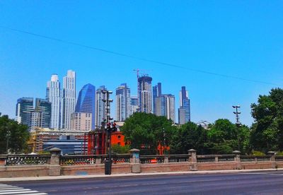 Cityscape against clear blue sky