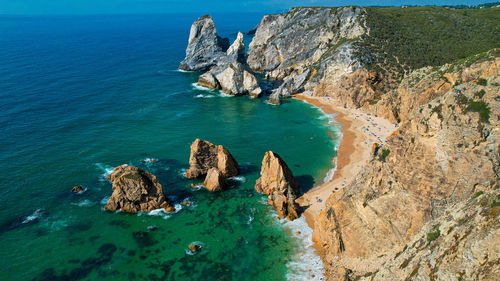 High angle view of rocks on sea