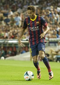 Boy playing in soccer ball