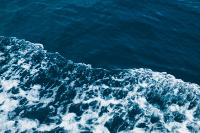 High angle view of sea by mountain