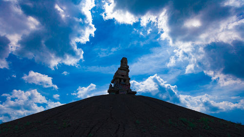 Low angle view of statue against sky