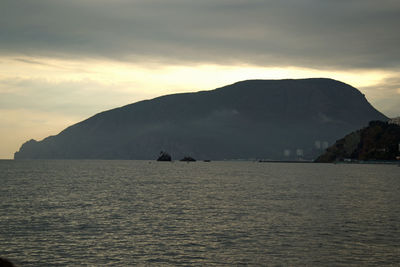 Scenic view of sea against sky at sunset