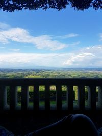 Scenic view of river against cloudy sky