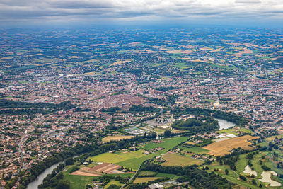 Aerial view of cityscape against sky