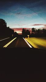 Road against sky at sunset