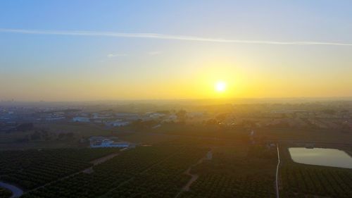 Scenic view of landscape at sunset