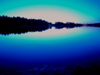 Reflection of trees in calm lake