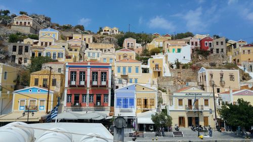 Low angle view of houses in village against sky