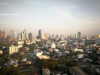 High angle view of modern buildings in city against sky