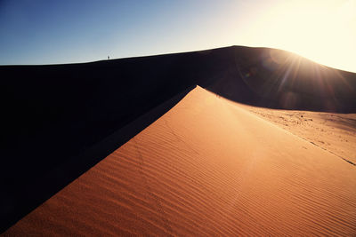 Scenic view of desert against clear sky