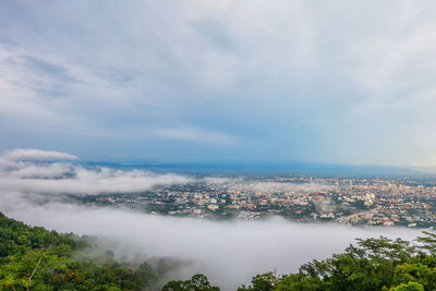 Aerial view of cityscape against sky