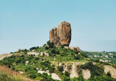 Castle on landscape against clear sky