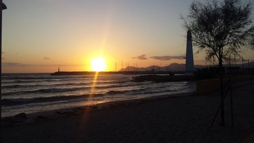 View of beach at sunset