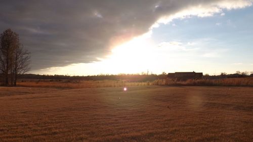 Scenic view of landscape against cloudy sky