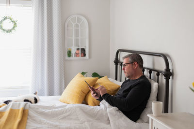 Man sitting on chair at home